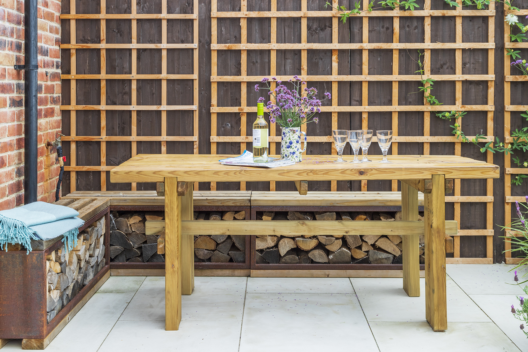 Small Urban Contemporary Garden, Sawbridgeworth Essex. Design and Build Cube 1994. Bespoke log holder seat