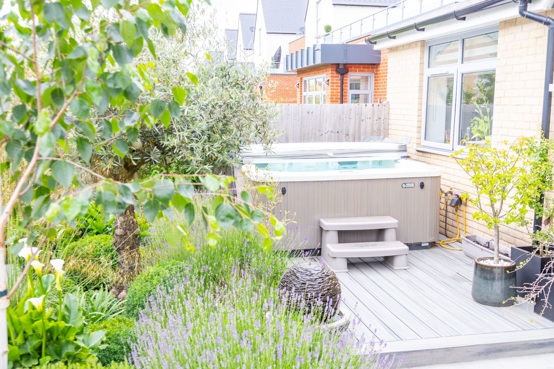 Urban Contemporary Garden, Chelmsford Essex Cube 1994 Urban Garden Hot Tub Screened with Mature Planting