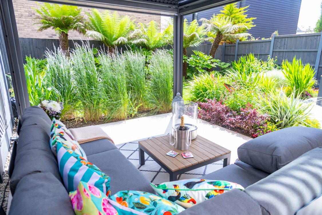 Small Urban Garden Tropical Planting Grasses Pergola Sofa Lounge