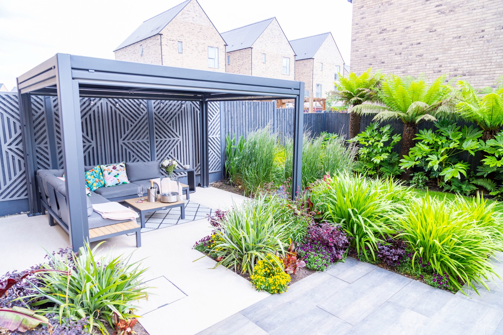 Small Urban Garden Tropical Planting Pergola Lounge Sofa Seating.jpg